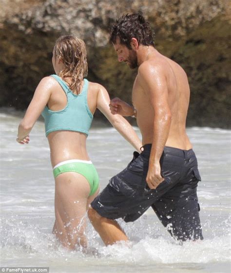 bradley cooper shows off his muscles while frolicking with girlfriend suki waterhouse hawaii
