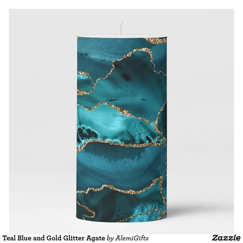 A Teal Candle With Gold Foil On It