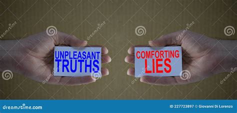 unpleasant truths versus conforting lies on cardboards in man`s hands stock image image of