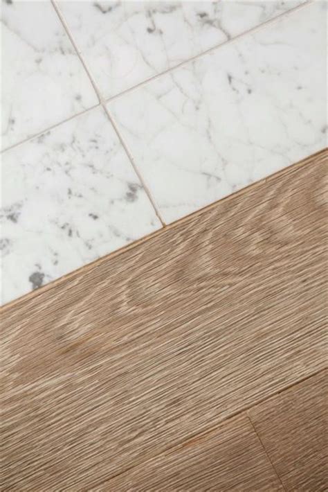 It usually has an attached cork backing for some extra cushioning and insulation. Ask Maria: Can I Combine Faux Hardwood Tile with my Oak ...
