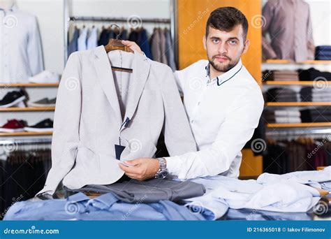 Salesman Displaying Classic Jacket Stock Photo Image Of Professional