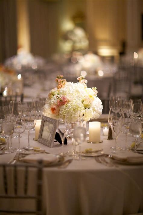 Beautiful Blooms Low White Centerpiece With Pops Of Peach Hydrangea