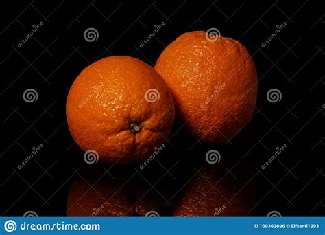 Oranges Fruit On A Black Background With Reflection Stock Photo Image