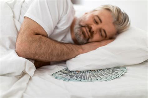Premium Photo Smiling Middle Aged Man Sleeping With Cash Under Pillow