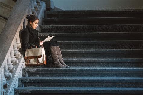 College Girl Reading A Book Del Colaborador De Stocksy Lumina Stocksy