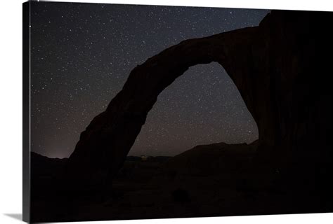 Starry Night Sky Over The Corona Arch Arches National Park Utah Wall