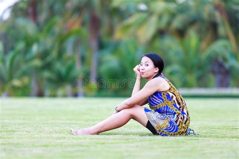 Asian Woman Sit On Ground In Park Stock Photo Image Of Cheerful