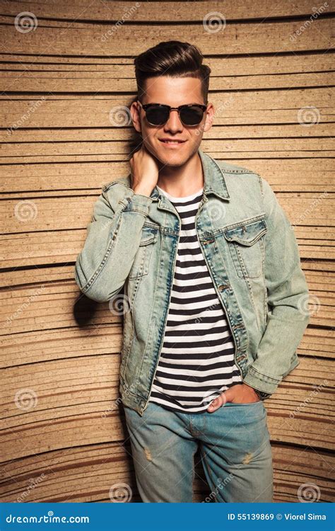 Relaxed Man In Jeans Jacket And Sunglasses Poses Stock Image Image Of