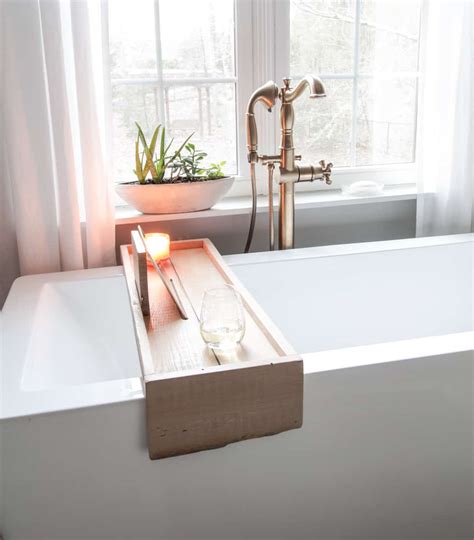 The first outstanding presence in the gallery is the work of a master only one block of wood has been used to shape the bathtub above, the noble look of the object thus. DIY Bathtub Tray with Reclaimed Wood - DeeplySouthernHome