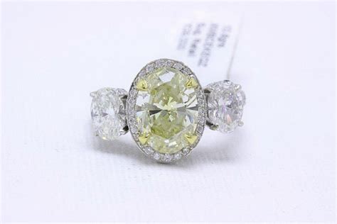 Pink diamond rings yellow diamond rings. Light Yellow Oval Diamond Three-Stone Engagement Ring 6.44 ...