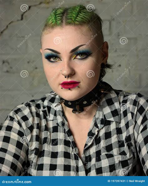 Tough Looking Punk Girl Facial Piercings And Green Hair Spiked Collar