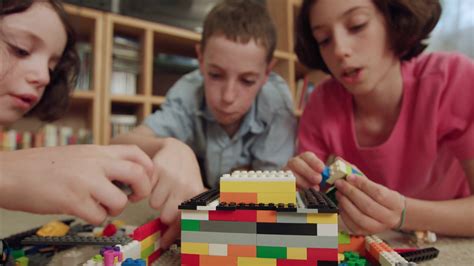 Three Kids Playing With Lego Bricks At Home Stock Footage Sbv 327184178