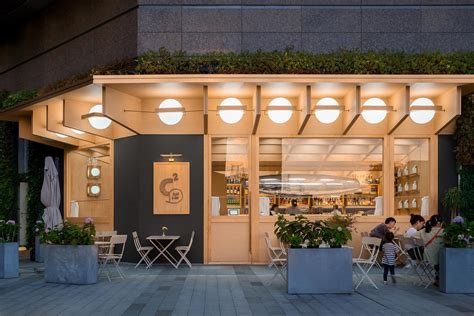 Large Orbs Of Light Surround The Exterior Of This Cafe And Bar Archi