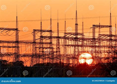 Power Lines High Masts For Electricity Transmission View At Sunset