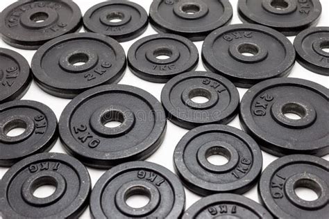 Black Metal Weights 1kg And 2kg On White Background Stock Image
