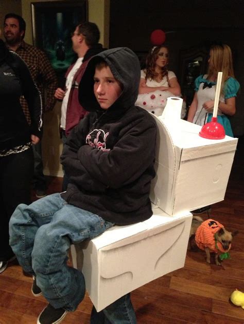 A Child Is Wearing A Child Sitting On Toilet Costume On A Halloween