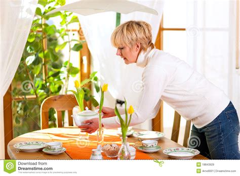 Oct 01, 2019 · once you realize table setting is based on logic, things become less intimidating, says etiquette consultant pamela hillings.for example, you begin eating a meal by using the flatware at the outside left and right, and then working your way in towards the plate as the meal proceeds. Woman Setting The Table For Tea Of Coffee Time Stock Image ...