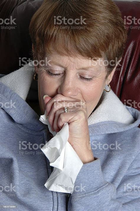 Senior Woman Coughing Into Hand Stock Photo Download Image Now 55