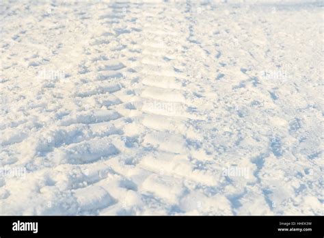 Car Tracks In Fresh White Snow Stock Photo Alamy