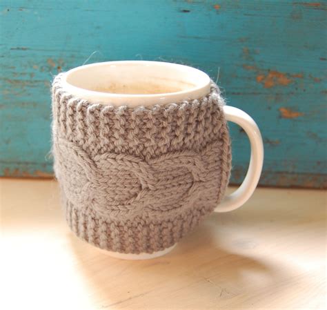 As long as there are objects in this world, knitters will find a way to cover them in knitting. Knit coffee mug cozy with cable pattern, hand knitted ...