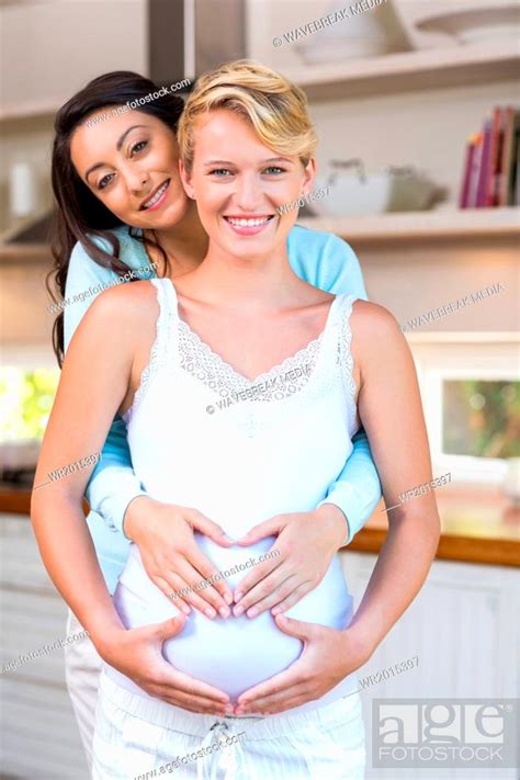 Lesbian Touching Her Pregnant Girlfriends Stomach Stock Photo Picture