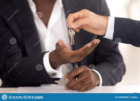 Realtor Hand Giving Keys To African New House Owner Stock Image Image