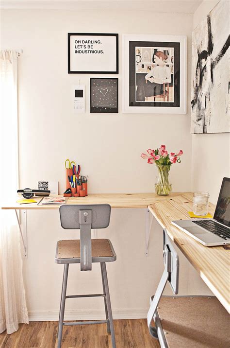 Instead of using typical desk table legs, this diy standing desk is hung on the wall. Building a Standing Desk - A Beautiful Mess