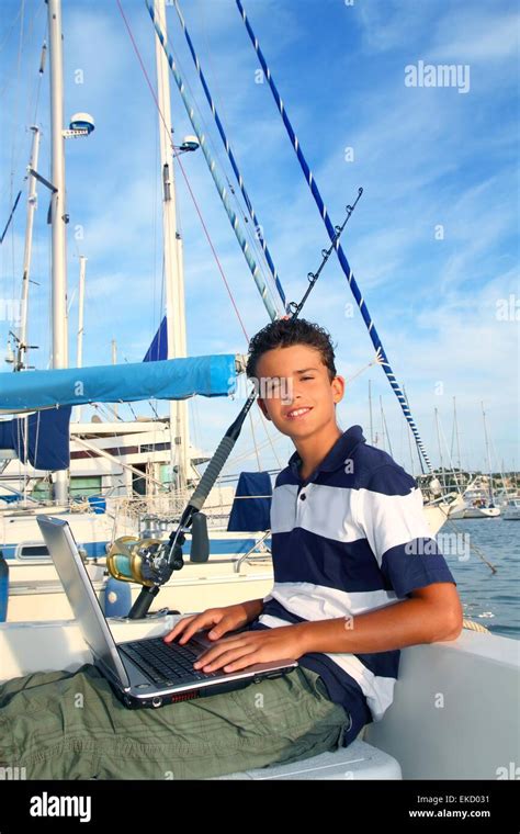Boy Teenager Seat On Boat Marina Laptop Computer Stock Photo Alamy