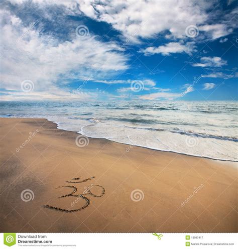 Om Symbol On The Beach Royalty Free Stock Photography