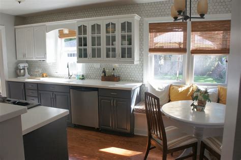 This kitchen featured on the hgtv show is tempting us to paint our kitchen cabinets an elegant shade of navy blue. Remodelaholic | Gray and White Kitchen Makeover with Hexagon Tile Backsplash