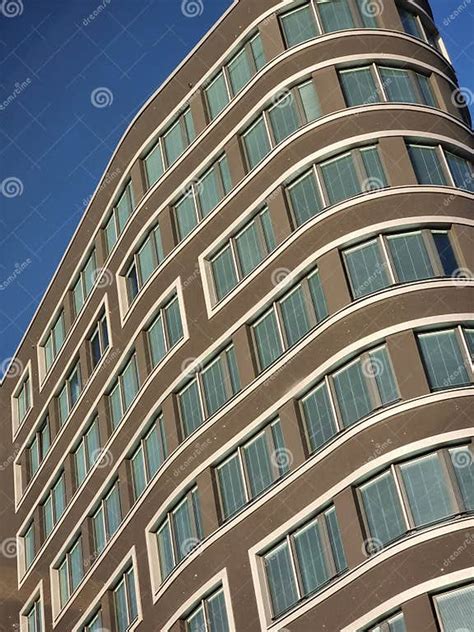 A Very Tall Building With Lots Of Windows Stock Photo Image Of