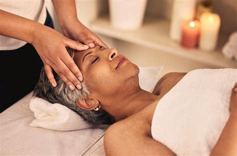 Woman Face And Head Massage At Spa With Beauty Therapist Skincare Treatment And Healing At