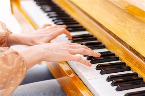 Close Up Of Hands Playing The Piano Stock Photo Image Of Blurred