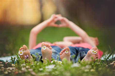 Happy Little Children Lying In The Grass Barefoot Daisies Aro Stock