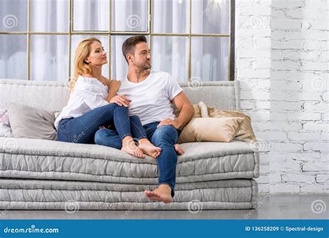 Young Couple Cuddling On The Sofa Stock Image Image Of Feelings Girlfriend 136258209