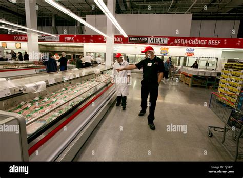 COSTCO employees arrange items in newly open store in Texas Stock Photo