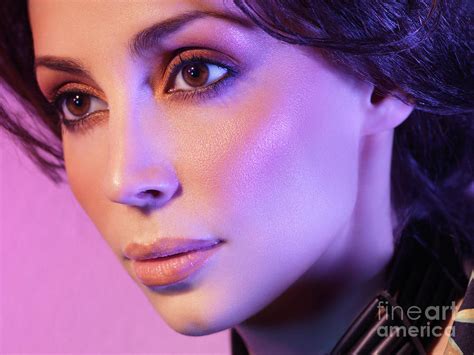 Closeup Beauty Portrait Of Woman Face In Colored Purple Light