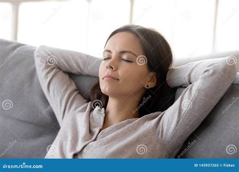 Calm Woman Putting Hands Behind Head Resting On Comfortable Couch Stock Image Image Of Quiet