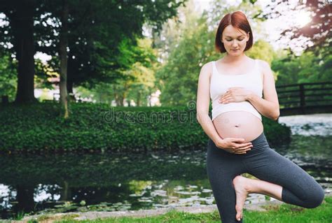 beautiful pregnant woman doing prenatal yoga on nature outdoors stock image image of lake