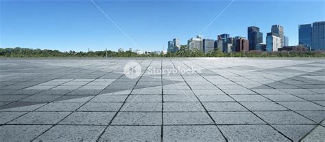 Empty Marble Floor With Cityscape And Skyline In Clear Blue Sky Royalty
