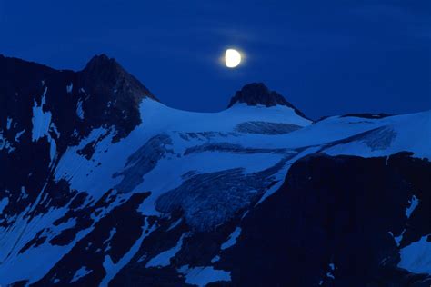 Full Moon Over Winter Mountains