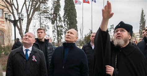 putin visits occupied crimea a day after war crimes warrant the new york times