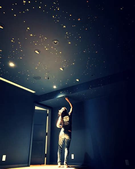 When you decorate your ceiling with constellations, you can drift off to sleep soothed by your very own starry sky. Patterns of constellations in gold on this theater ceiling ...