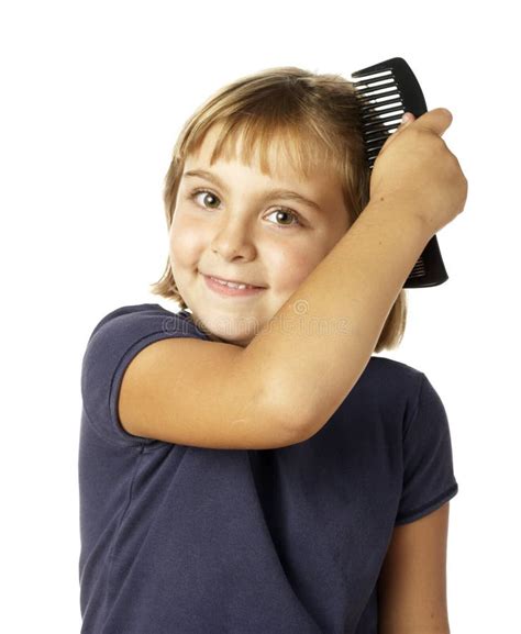 Girl Combing Her Hair In Front Of Mirror Stock Image Image Of Combing