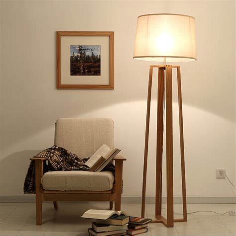 Many homes lack ceiling lights in their living spaces, but invest in floor lamps to add extra light and style to your living room. Wood Floor standing lamp for living room/ reading floor ...