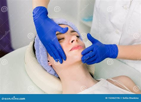 Beautiful Young Caucasian Woman Relaxing With Face Massage And Cosmetology Procedures At Beauty