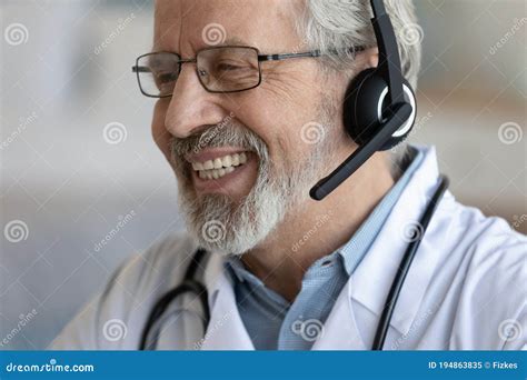 Close Up Smiling Mature Doctor Wearing Headset Working Online Stock Image Image Of Happy Good