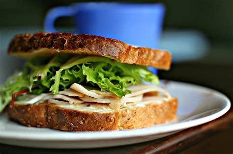 turkey lettuce and mayo sandwich on whole wheat bread the simplest pleasures can often be the