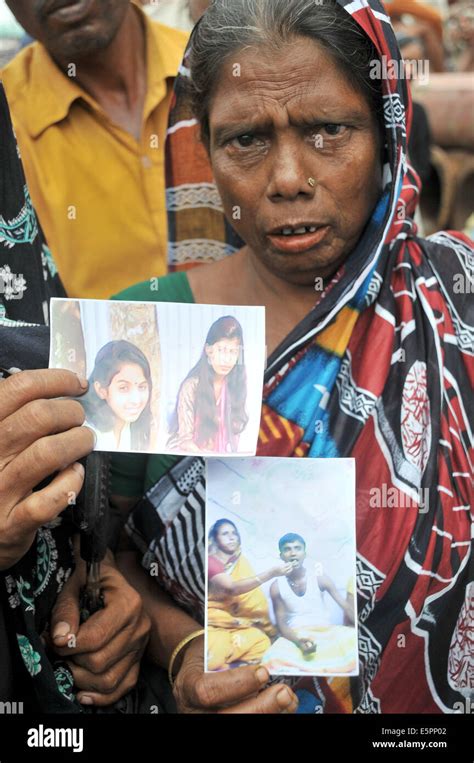 mawa bangladesh 5th aug 2014 a bangladeshi women shows pictures of her missing relatives as