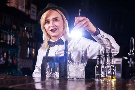 Focused Girl Barman Surprises With Its Skill Bar Visitors On The Bar